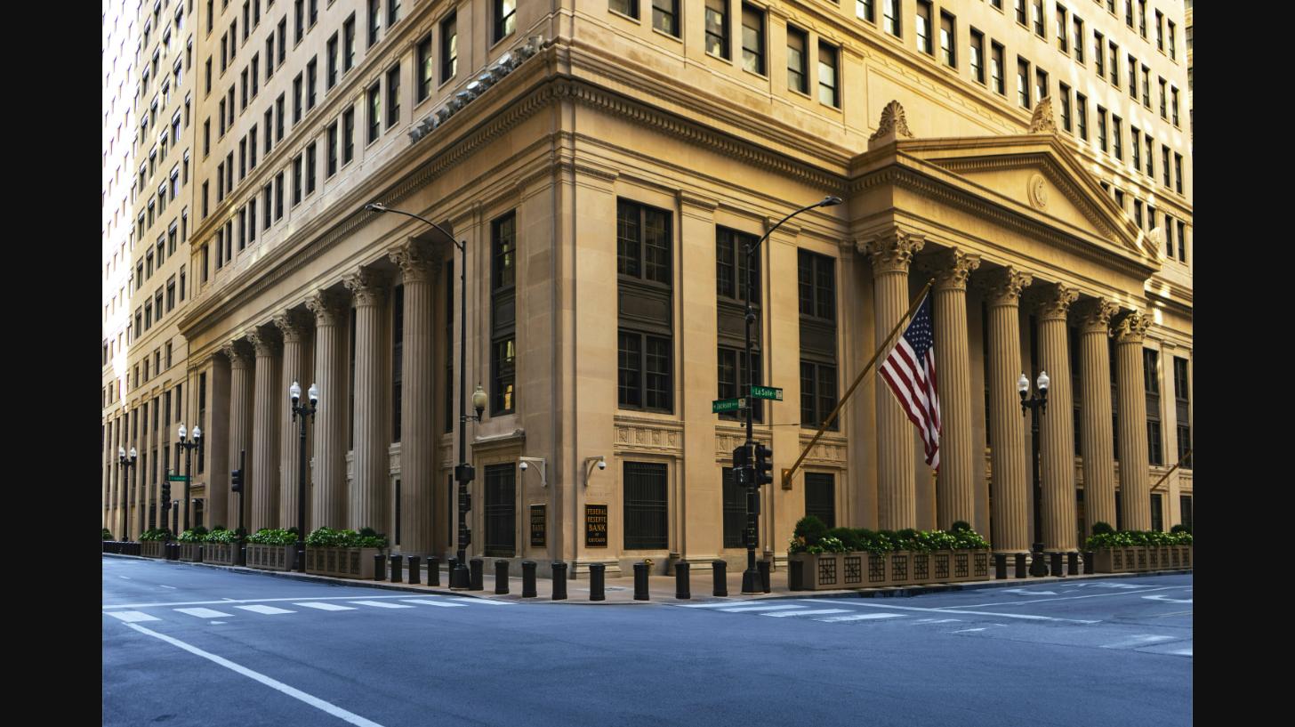 Classical bank building with columns, illustrating the risks of adding a child to a bank account or deed in Texas